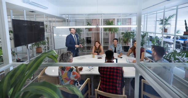 istock Multi ethnic business team meeting 1203616419