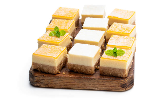 istock Set of mini lemon and vanilla cheesecake bites isolated on white 1203619249