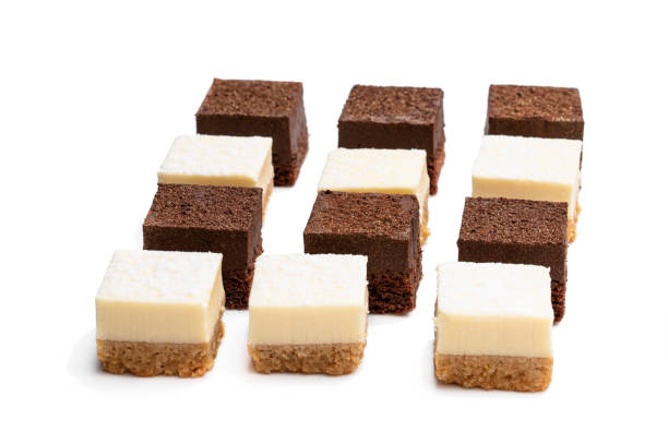 istock Set of mini chocolate and vanilla cheesecake bites isolated on white 1203619272