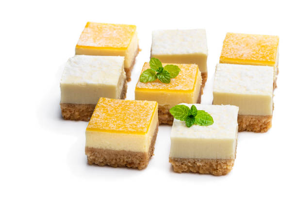 istock Set of mini lemon and vanilla cheesecake bites isolated on white 1203619281
