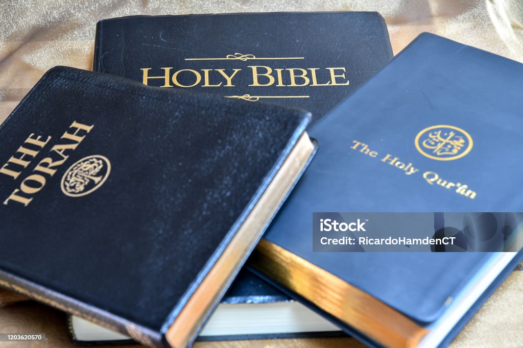 Three Holy Books Holy Bible, The Torah, The Holy Qur'ân Bible Stock Photo