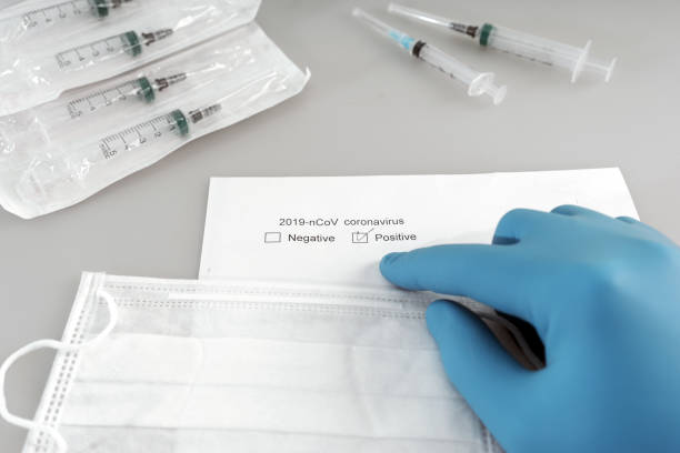 istock doctor points to positive test for new rapidly spreading coronavirus 2019-nCOV 1203623388