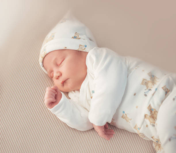 istock Newborn adorable one week baby boy sleeping 1203623807