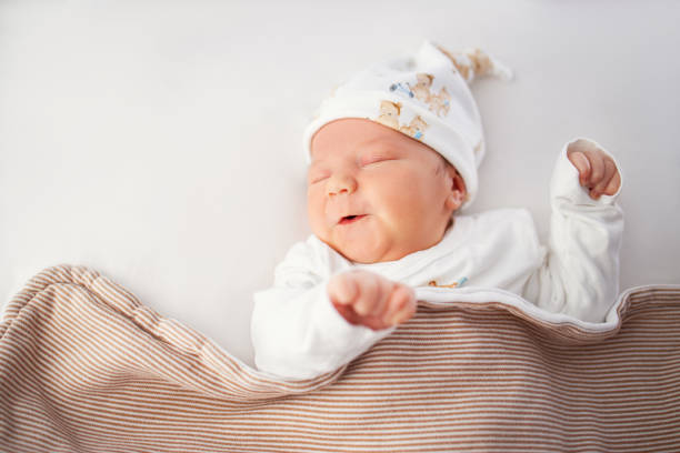 istock Newborn adorable one week baby boy sleeping 1203623808
