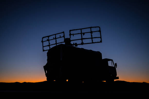 istock Satellite dishes or radio antennas against evening sky. Selective focus 1203626504