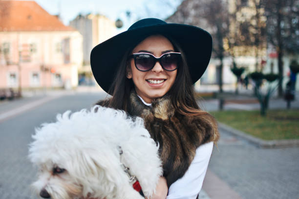 istock Attractive Girl and White Puppy 1203626556