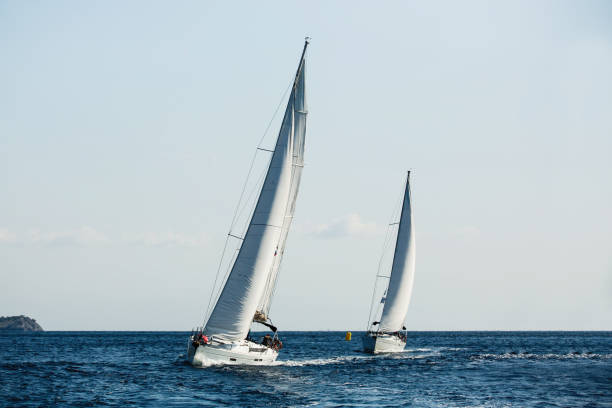 istock Yachts ship with white sails in the Sea at sailing regatta. 1203629585