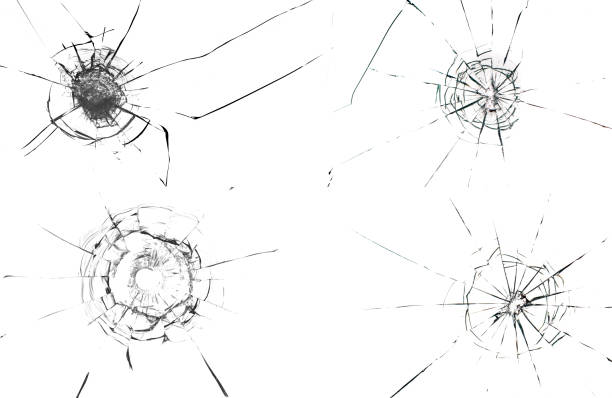 istock Round white cracks in glass on black background. 1203629758