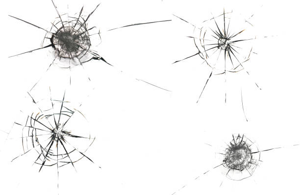 istock Round white cracks in glass on black background. 1203629772