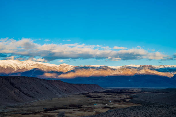 istock California valley view with snowy Sierra Nevada mountain range 1203631541