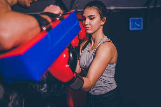 istock Young man and women boxer on training 1203633749