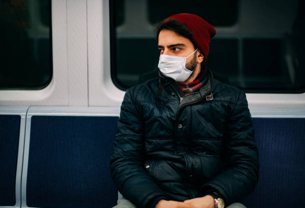 Man Wearing a Sterile Mask in the Subway