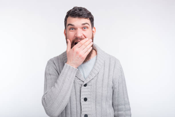 istock Really. Strongly surprised man is looking at the camera, covering his month. 1203634065