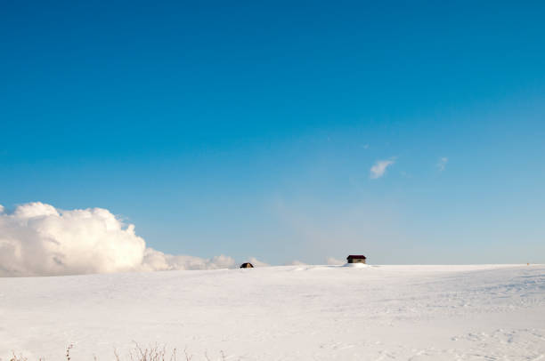 istock Snowy hills on a sunny winter day 1203637103
