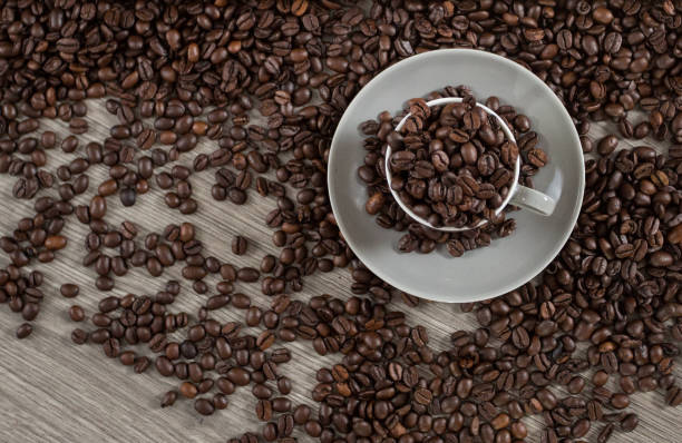 istock Roasted coffee beans in a caffee mug 1203638071