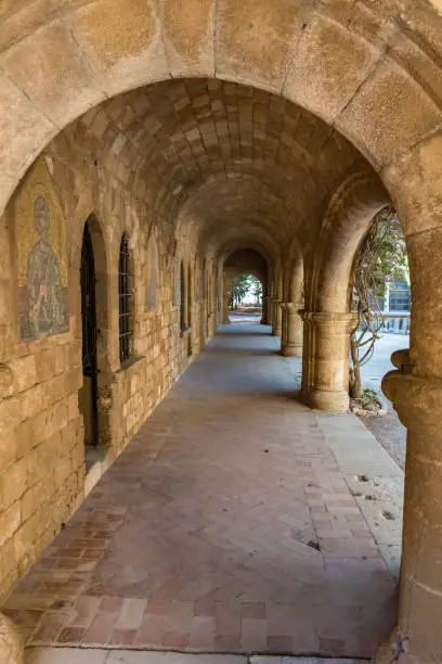 Column corridor with icons of Saints in Monastery of Filerimos on Acropolis of Ialyssos (Rhodes, Greece)