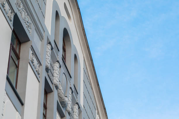istock Diagonal bottom view of white building 1203640987