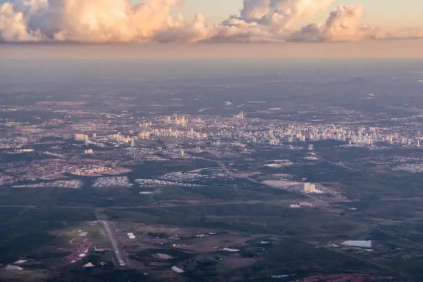 At 6,200 feet, aerial view of the city of Cuiabá, Mato Grosso, Brazil. On the left side of the image, Bom Futuro Airport. Higher up in the upper right corner of the image you can see the elevation of the Santo Antonio hill of the city Santo Antonio do Leverger.