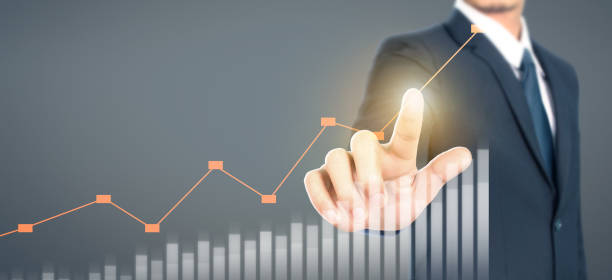 istock Businessman plan graph growth and increase of chart positive indicators 1203654631