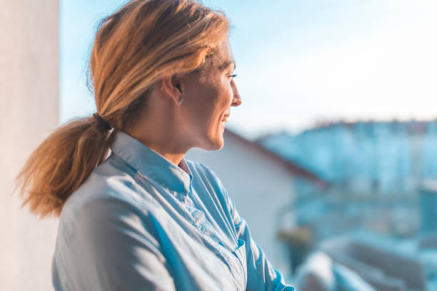 istock Thoughtful redhead woman looking away on sunny day 1203655291