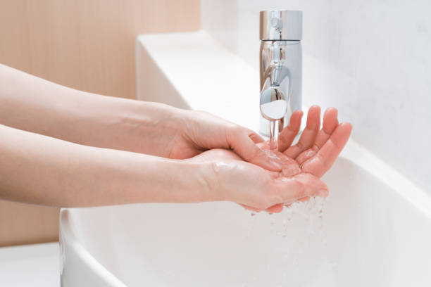 istock Asian woman washing hands 1203659970