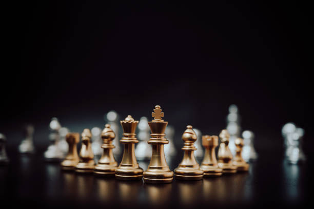 istock Leader and success business competition concept. Chess board game strategy 1203661344