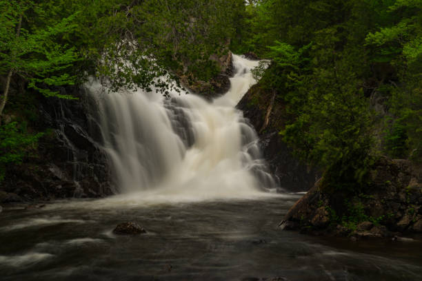 istock Chute Archambault Waterfall in Quebec, Canada 1203667071