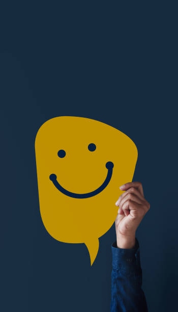 istock Customer Experiences Concept. Modern People Raised up Hand to Giving a Happy Face Icon and Positive Review on Card. Client's Satisfaction Surveys. Front View 1203673110
