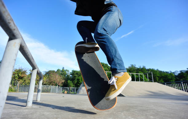 istock Skateboarder skateboarding on skate park 1203675489