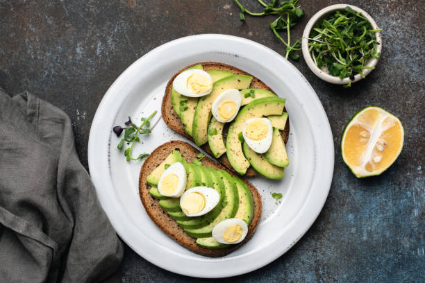 Rye bread toast with avocado and quail egg