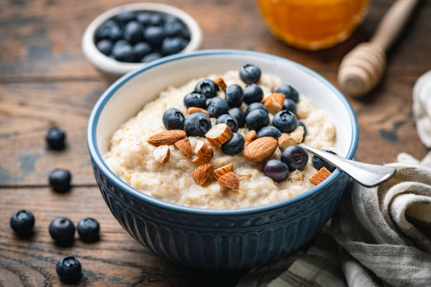 istock Oatmeal porridge with blueberries, almonds 1203675600