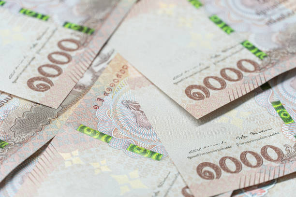 Hand during counting 1000 Thai banknote on white background