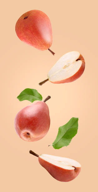 istock Floating pear fruits isolated on coloured background 1203684366