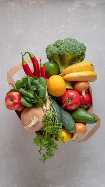 A grocery bag full of organic products. Top view, eco friendly shop.