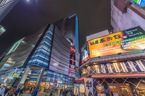 Tokyo Japan - March 12, 2017 : Shinjuku district with young japanese and tourists walk past this area has many shops full to shopping and restaurants. one of Tokyo's must-see places to visit.