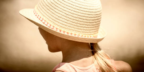 istock Cute girl in a straw hat 1203688591