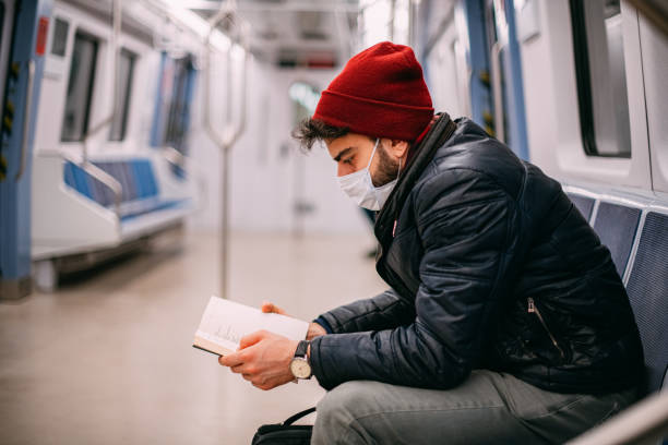 istock Man Wearing a Sterile Mask in the Subway 1203688768