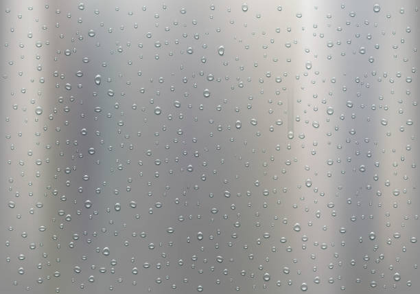 istock Drops of water on a polished metal plate. 1203688890