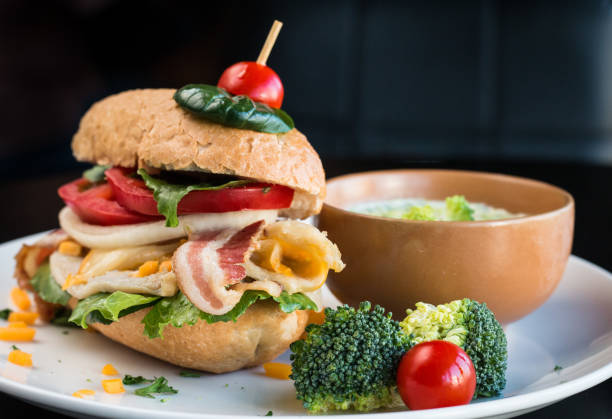 istock Loaded Gourmet Burger with bacon and vegetables and broccoli soup. 1203691137