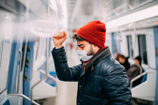 istock Tired and Sick Man in the Subway 1203693593
