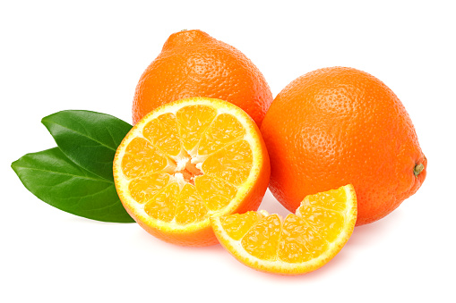 Orange clementine or minneola tangelo with slices and green leaves isolated on white background. Tangerine. Citrus fruit.