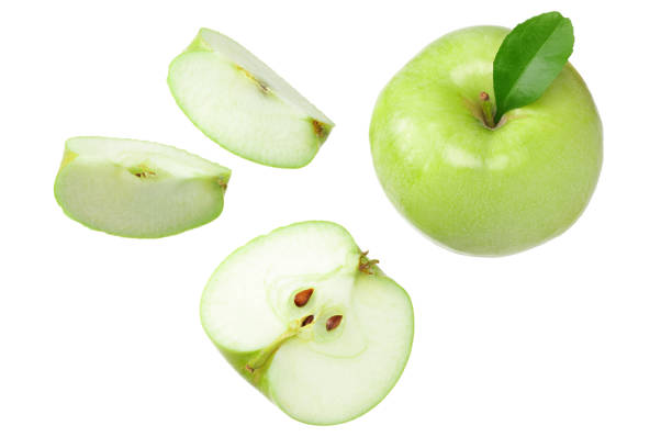 istock green apples with slices isolated on white background. top view 1203693986