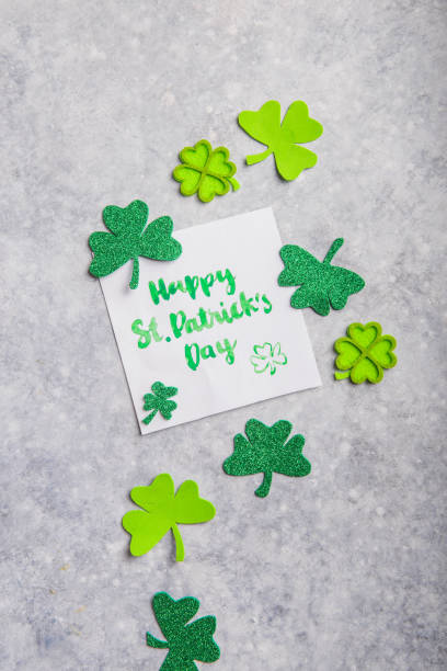istock Happy Saint Patricks Day flat lay composition with card, shamrock leaf clovers 1203695386
