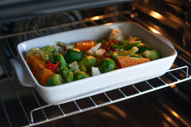 istock Oven-baked vegetables in white uniform 1203697400