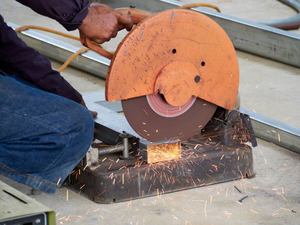 istock Circular cutting disc cuts off part of iron until sparks occur while cutting steel. 1203697513