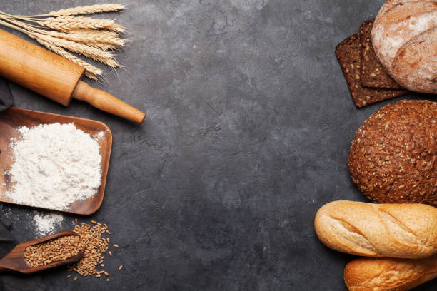 istock Various bread with wheat, flour and cooking utensils 1203698684