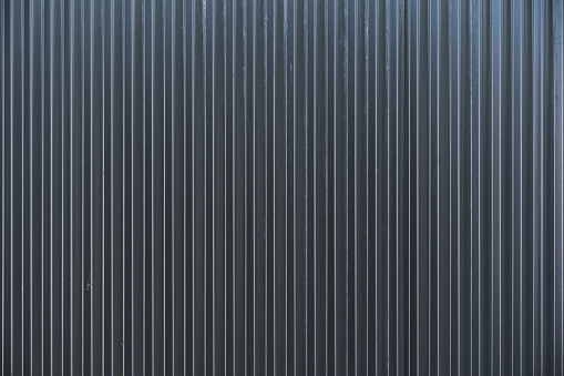 Dark grey Colorbond sheet metal fencing background texture