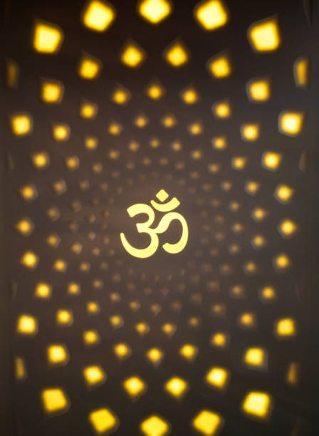 istock hindu religion focused aum letter surrounded by the lights 1203699351