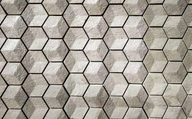 vitrified tiles in a hexagonal geometrical pattern with grey and white texture can be used as a background