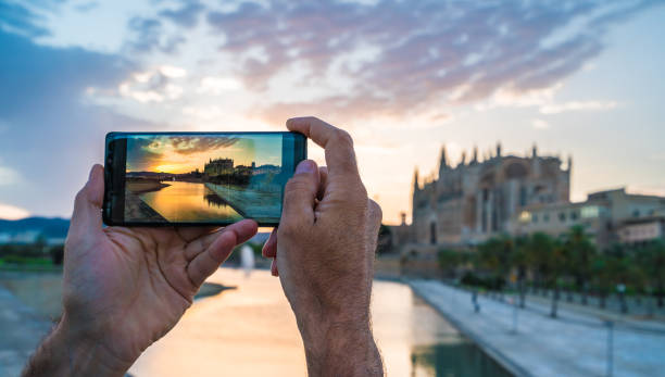 istock Men using her smartphone for take a photo in Palma de Mallorca 1203700167